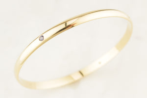 CONTEMPORARY DIAMOND & SPINEL BANGLE 9ct GOLD