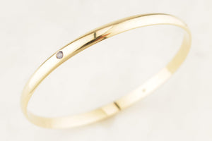 CONTEMPORARY DIAMOND & SPINEL BANGLE 9ct GOLD
