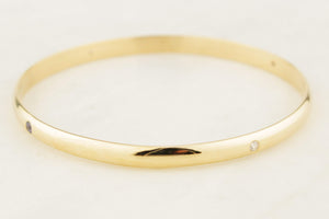 CONTEMPORARY DIAMOND & SPINEL BANGLE 9ct GOLD