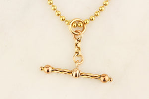 ANTIQUE SPINNING T-BAR PENDANT 9ct GOLD