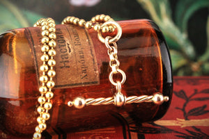 ANTIQUE SPINNING T-BAR PENDANT 9ct GOLD