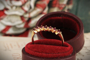 VINTAGE SEVEN STONE RUBY HALF HOOP 14CT YELLOW GOLD