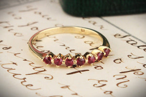 VINTAGE SEVEN STONE RUBY HALF HOOP 14CT YELLOW GOLD