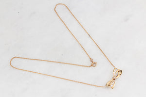 VINTAGE .32ct DIAMOND BOW NECKLACE 18ct & 9ct GOLD