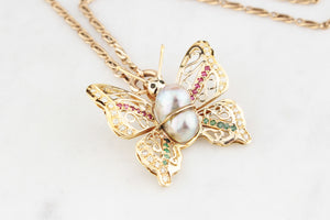 VINTAGE BUTTERFLY PENDANT WITH EMERALDS, RUBIES, DIAMONDS & PEARL 14ct GOLD