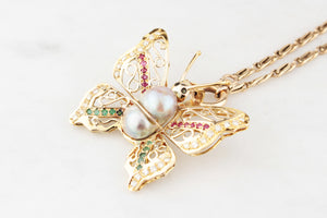 VINTAGE BUTTERFLY PENDANT WITH EMERALDS, RUBIES, DIAMONDS & PEARL 14ct GOLD