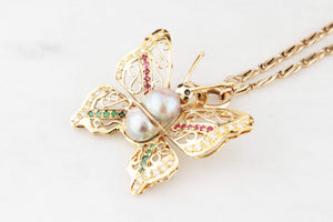 VINTAGE BUTTERFLY PENDANT WITH EMERALDS, RUBIES, DIAMONDS & PEARL 14ct GOLD