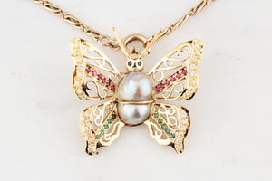 VINTAGE BUTTERFLY PENDANT WITH EMERALDS, RUBIES, DIAMONDS & PEARL 14ct GOLD