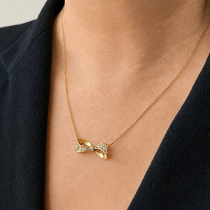 VINTAGE .32ct DIAMOND BOW NECKLACE 18ct & 9ct GOLD