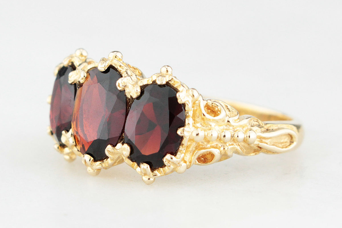 RETRO 1974 GARNET TRILOGY RING 9CT GOLD