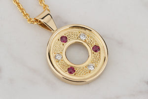 MODERN RUBY & DIAMOND PENDANT ON 18ct YELLOW GOLD