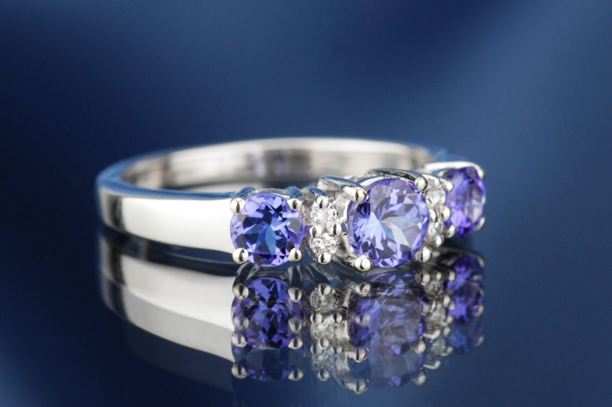 MODERN TANZANITE & DIAMOND HALF HOOP RING ON 18ct WHITE GOLD