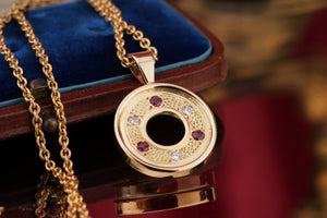 MODERN RUBY & DIAMOND PENDANT ON 18ct YELLOW GOLD