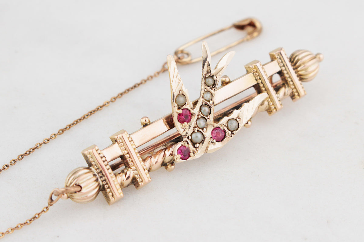 ANTIQUE AUSTRALIAN RUBY AND SEED PEARL SWALLOW BROOCH 9ct GOLD