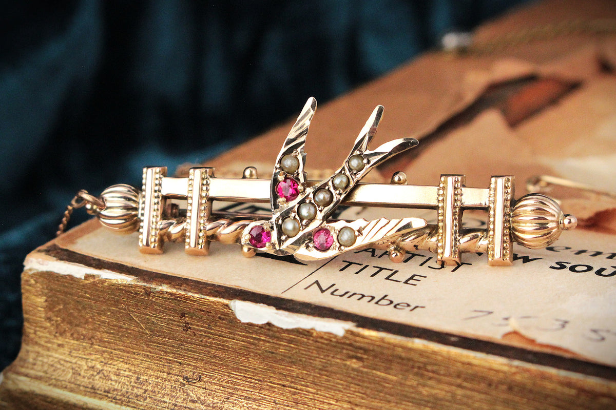 ANTIQUE AUSTRALIAN RUBY AND SEED PEARL SWALLOW BROOCH 9ct GOLD