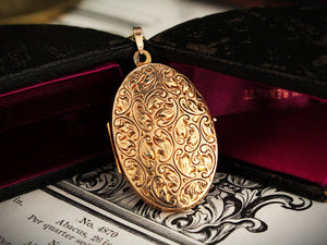 ANTIQUE ENGRAVED OVAL LOCKET 9ct GOLD