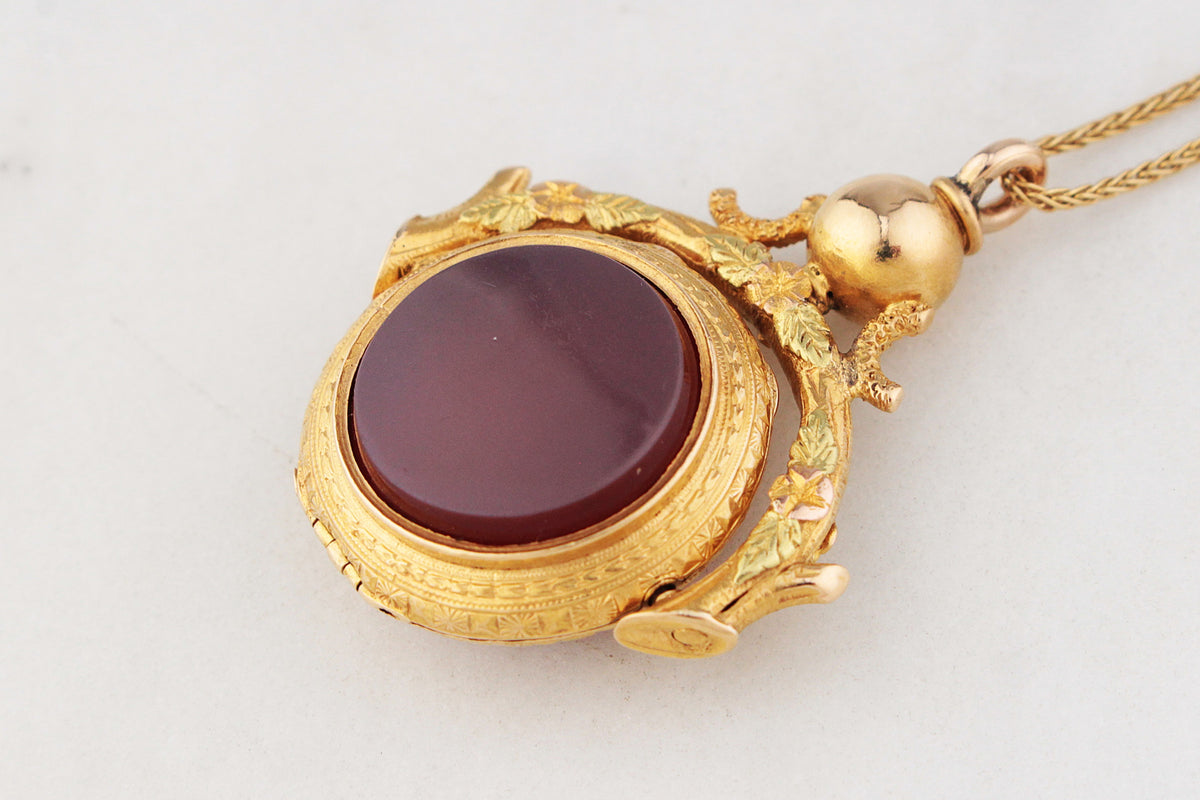 ANTIQUE VICTORIAN DOUBLE SIDED CARNELIAN SPINNING FOB LOCKET 15ct GOLD