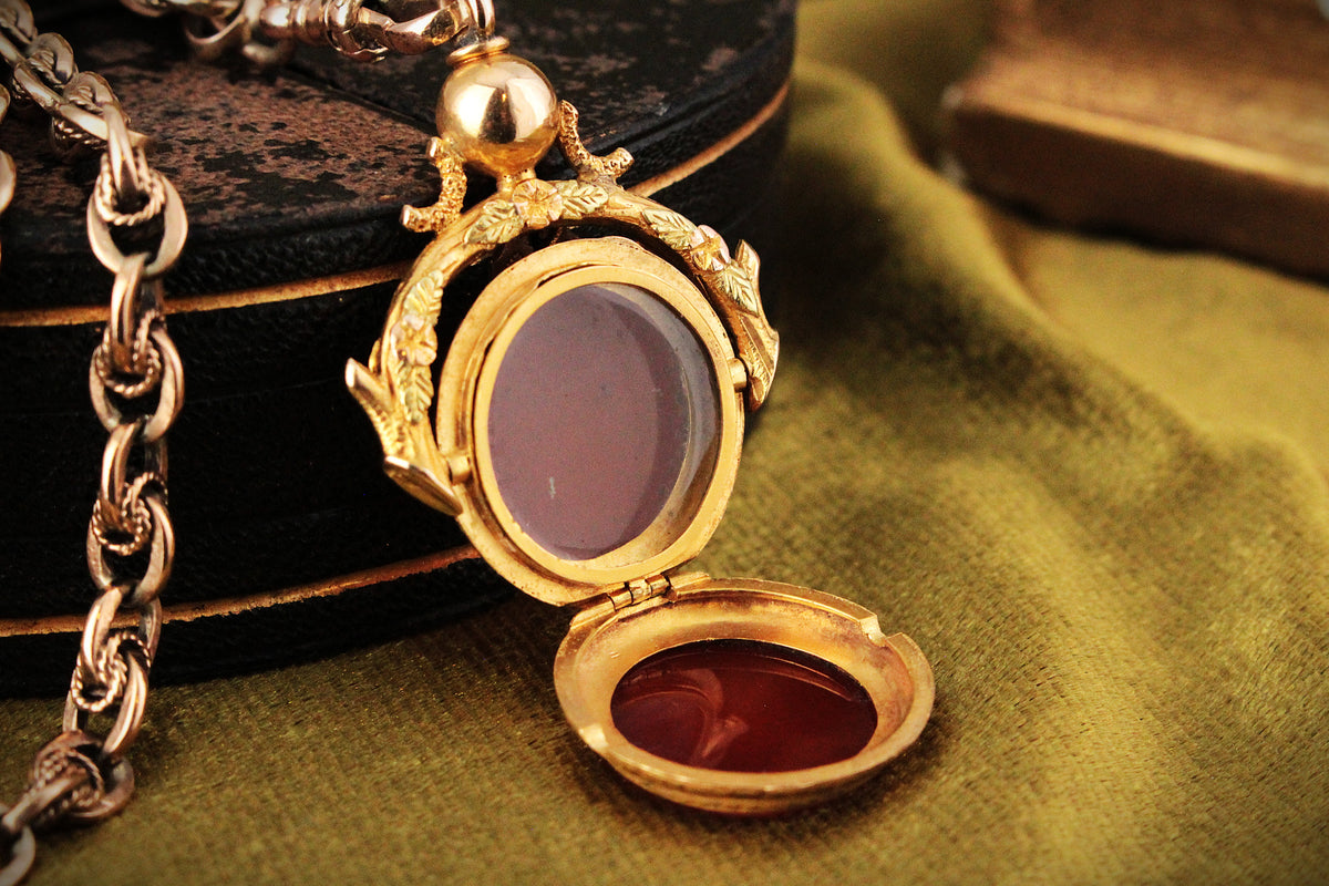 ANTIQUE VICTORIAN DOUBLE SIDED CARNELIAN SPINNING FOB LOCKET 15ct GOLD