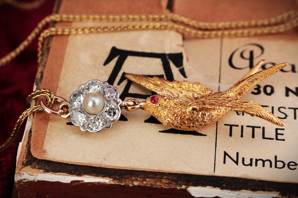 ANTIQUE DIAMOND, PEARL &amp; RUBY SWALLOW PENDANT 15 &amp; 18ct GOLD