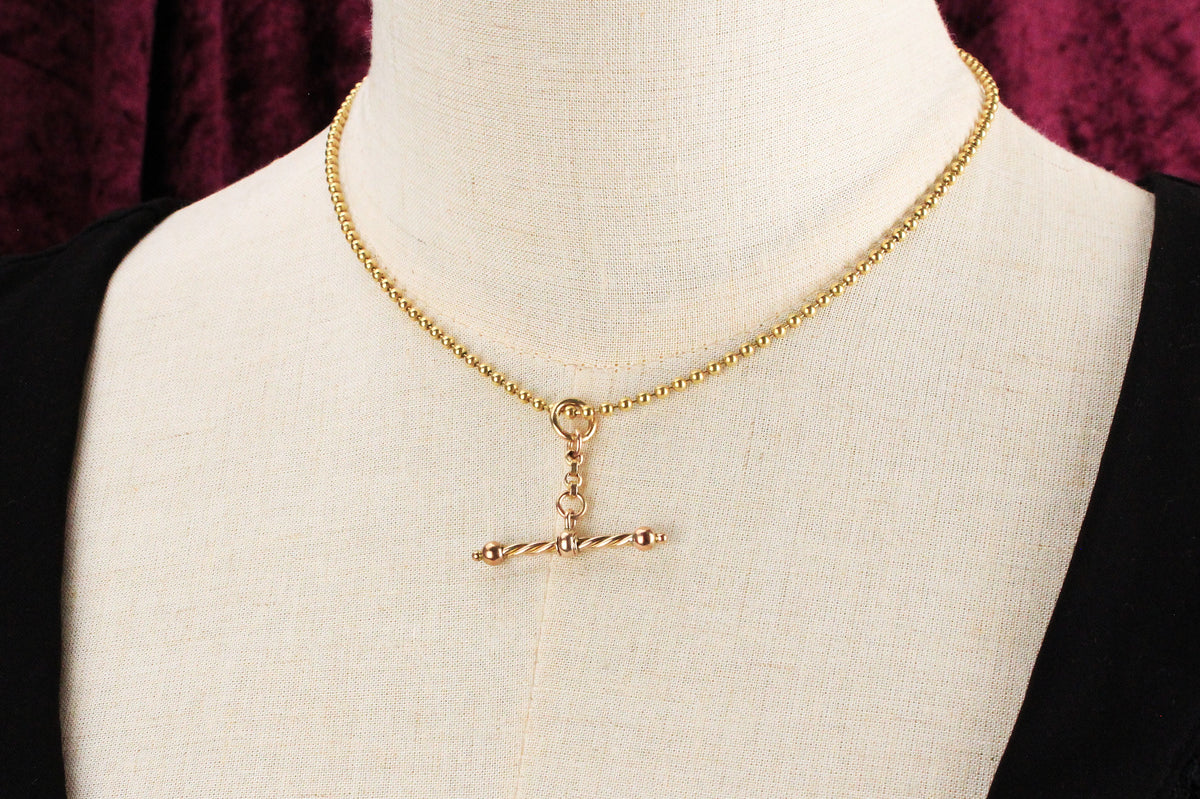 ANTIQUE SPINNING T-BAR PENDANT 9ct GOLD