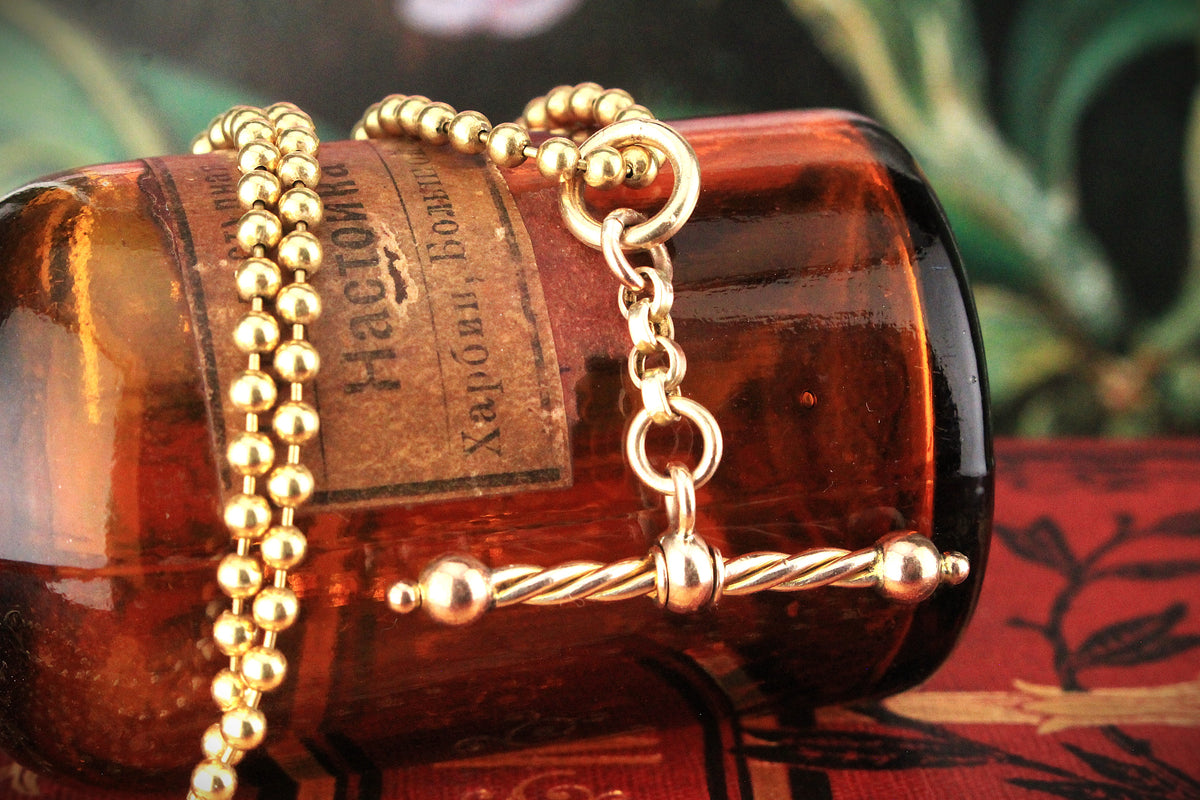 ANTIQUE SPINNING T-BAR PENDANT 9ct GOLD