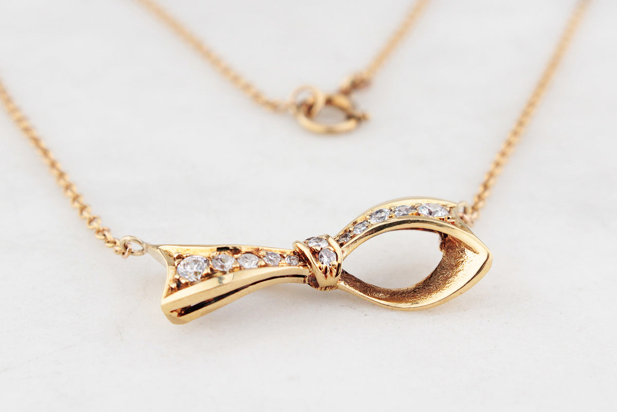 VINTAGE .32ct DIAMOND BOW NECKLACE 18ct & 9ct GOLD