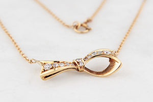 VINTAGE .32ct DIAMOND BOW NECKLACE 18ct & 9ct GOLD