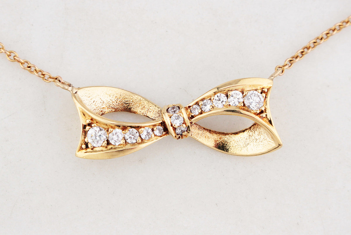 VINTAGE .32ct DIAMOND BOW NECKLACE 18ct & 9ct GOLD