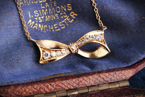 VINTAGE .32ct DIAMOND BOW NECKLACE 18ct & 9ct GOLD