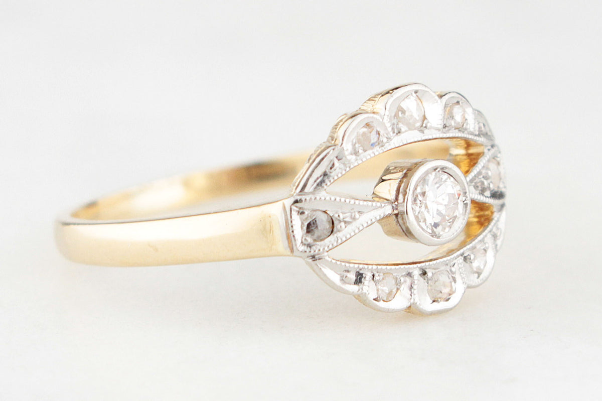 ANTIQUE DIAMOND HALO RING IN 18ct GOLD