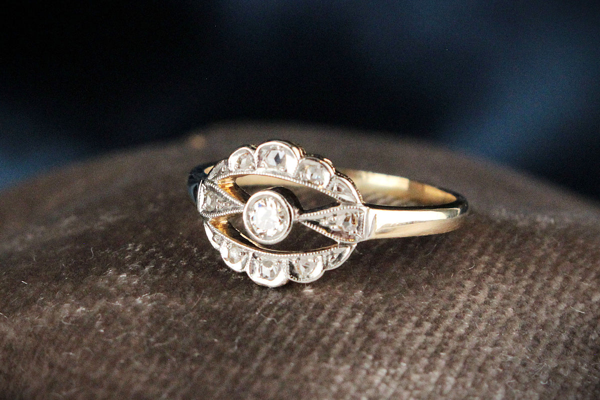 ANTIQUE DIAMOND HALO RING IN 18ct GOLD