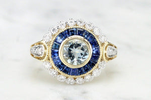 MODERN AQUAMARINE SAPPHIRE AND DIAMOND TARGET RING ON 9ct YELLOW GOLD