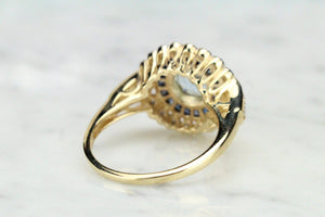 MODERN AQUAMARINE SAPPHIRE AND DIAMOND TARGET RING ON 9ct YELLOW GOLD