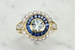 MODERN AQUAMARINE SAPPHIRE AND DIAMOND TARGET RING ON 9ct YELLOW GOLD