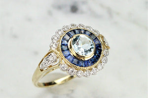 MODERN AQUAMARINE SAPPHIRE AND DIAMOND TARGET RING ON 9ct YELLOW GOLD