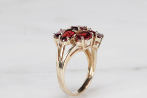 MODERN ESTATE PYROPE GARNET CLUSTER RING ON 9ct YELLOW GOLD