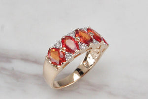 MODERN ORANGE SAPPHIRE & DIAMOND HALF-HOOP RING ON 14ct YELLOW GOLD