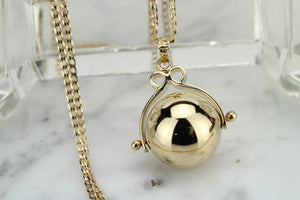 MODERN ESTATE BALL SPINNER PENDANT AND CHAIN ON 9ct YELLOW GOLD