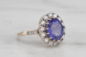 MODERN 4.09ct TANZANITE & DIAMOND HALO RING ON 14ct YELLOW & WHITE GOLD