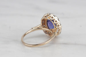 MODERN 4.09ct TANZANITE & DIAMOND HALO RING ON 14ct YELLOW & WHITE GOLD