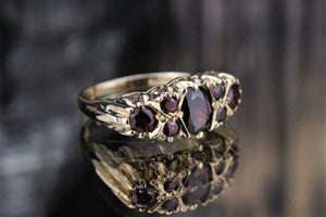 VINTAGE ESTATE GARNET BRIDGE RING ON 9ct YELLOW GOLD