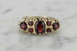 VINTAGE ESTATE GARNET BRIDGE RING ON 9ct YELLOW GOLD