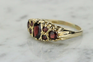 VINTAGE ESTATE GARNET BRIDGE RING ON 9ct YELLOW GOLD