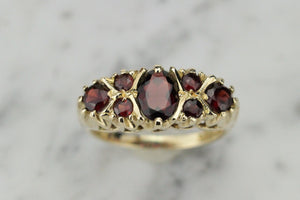 VINTAGE ESTATE GARNET BRIDGE RING ON 9ct YELLOW GOLD