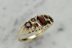 VINTAGE ESTATE GARNET BRIDGE RING ON 9ct YELLOW GOLD