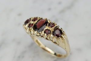 VINTAGE ESTATE GARNET BRIDGE RING ON 9ct YELLOW GOLD