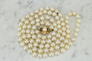 ESTATE VINTAGE SEMI-BAROQUE PEARL STRAND WITH EMERALD SET CLASP ON 14ct YELLOW GOLD