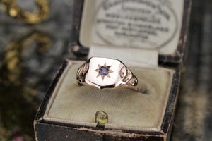 ANTIQUE C1915-20 SHIELD SIGNET WITH STAR FLUSH SET PURPLE SPINEL ON 9ct YELLOW GOLD