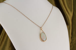 MID CENTURY SOLID WHITE OPAL PENDANT ON 10ct YELLOW GOLD